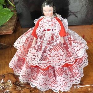 Vintage porcelain doll about 8 “ tall.